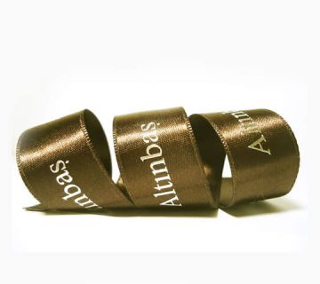 Logo printed satin ribbon that says altinbas