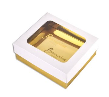 Lift off lid foldin carton with metallic gold lamination and clear window on the lid