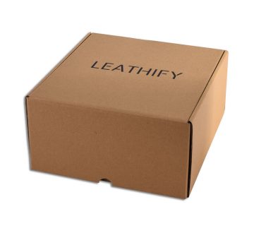 Brown kraft corrugated postal box that says Leathify