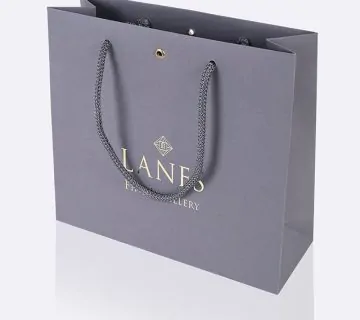 Grey pulp coloured uncoated luxury jeweller paper bag with hot foil printing and metal eyelet