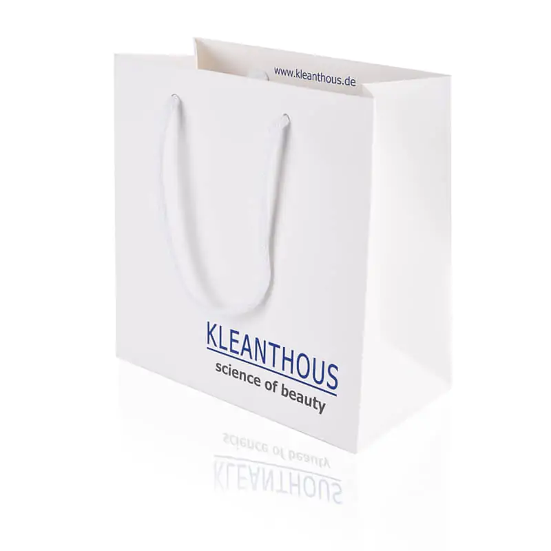 white matt laminated luxury paper basg with white rope that says Kleanthous