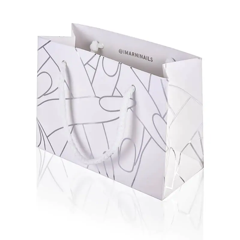 White luxury paper bag silver foil with finger and nail patterns