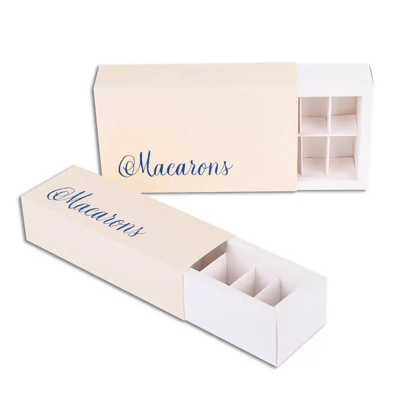 Beige macaron boxes with insert that say macarons