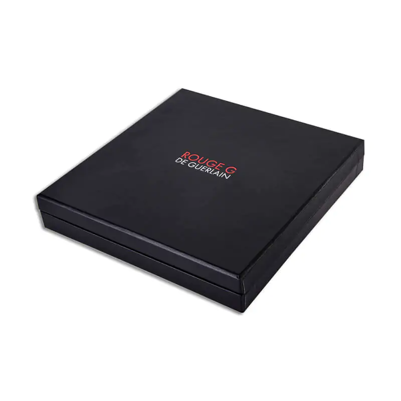 Black higed rigid gift box that says rouge g guerlain