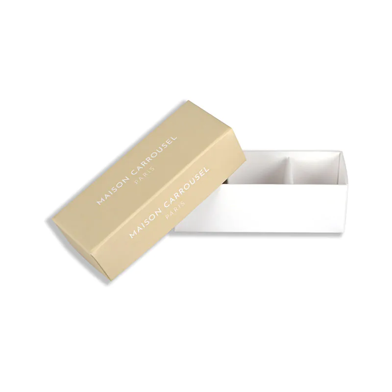 Beige macaron box with insert says maison carrusel