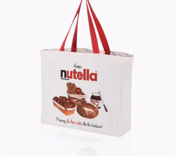 Thick natural cotton tote bag with red handles that says nutella