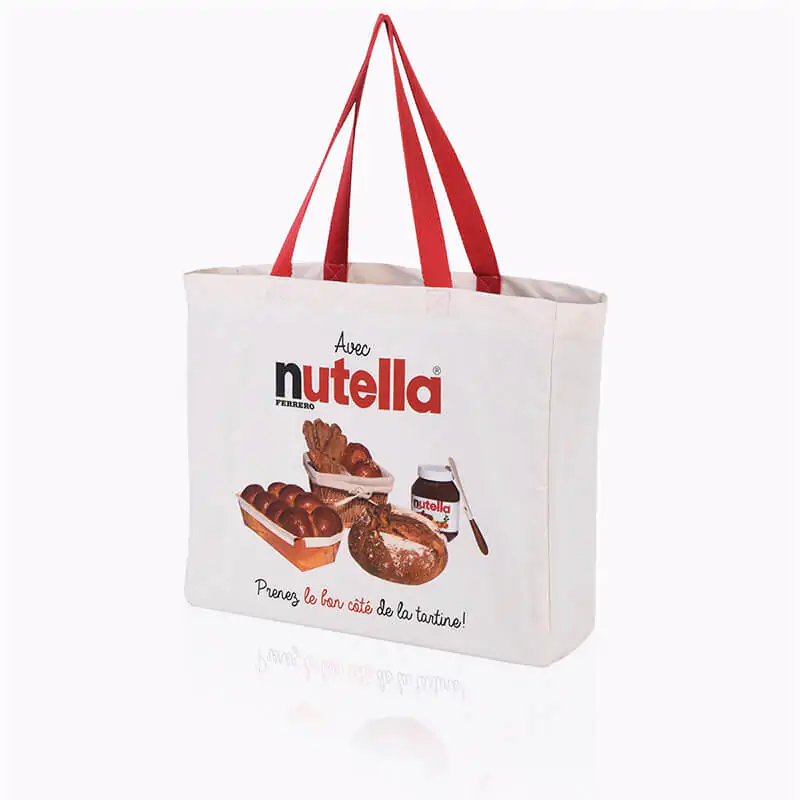 Thick natural cotton tote bag with red handles that says nutella
