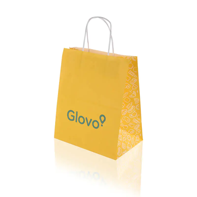 Twisted handle yellow kraft paper bag that says Glovo