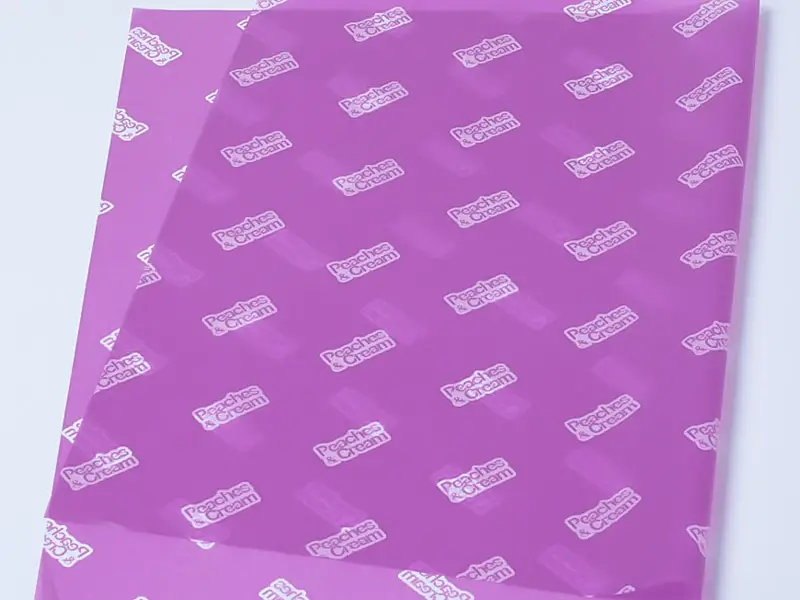 purple tissue paper with logo